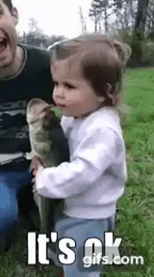 Little Girl Cuddles Fish, Says 'I Love You'
