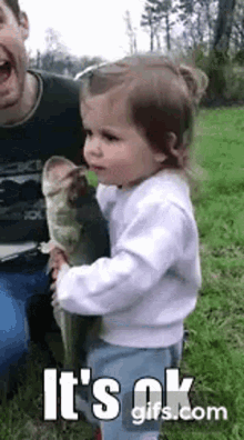 Little Girl Cuddles Fish, Says 'I Love You'