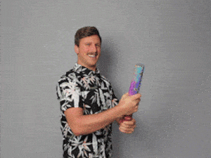 Excited Man Celebrates with Confetti Cannon