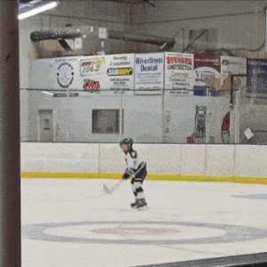 Young Hockey Player's Joyful Celebration