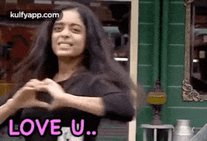 Woman Shows Love U with Heart Hands