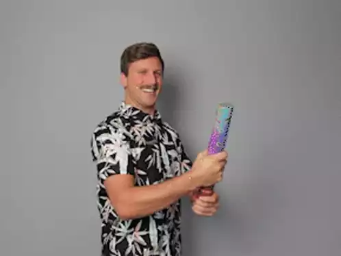 Excited Man Celebrates with Confetti Cannon